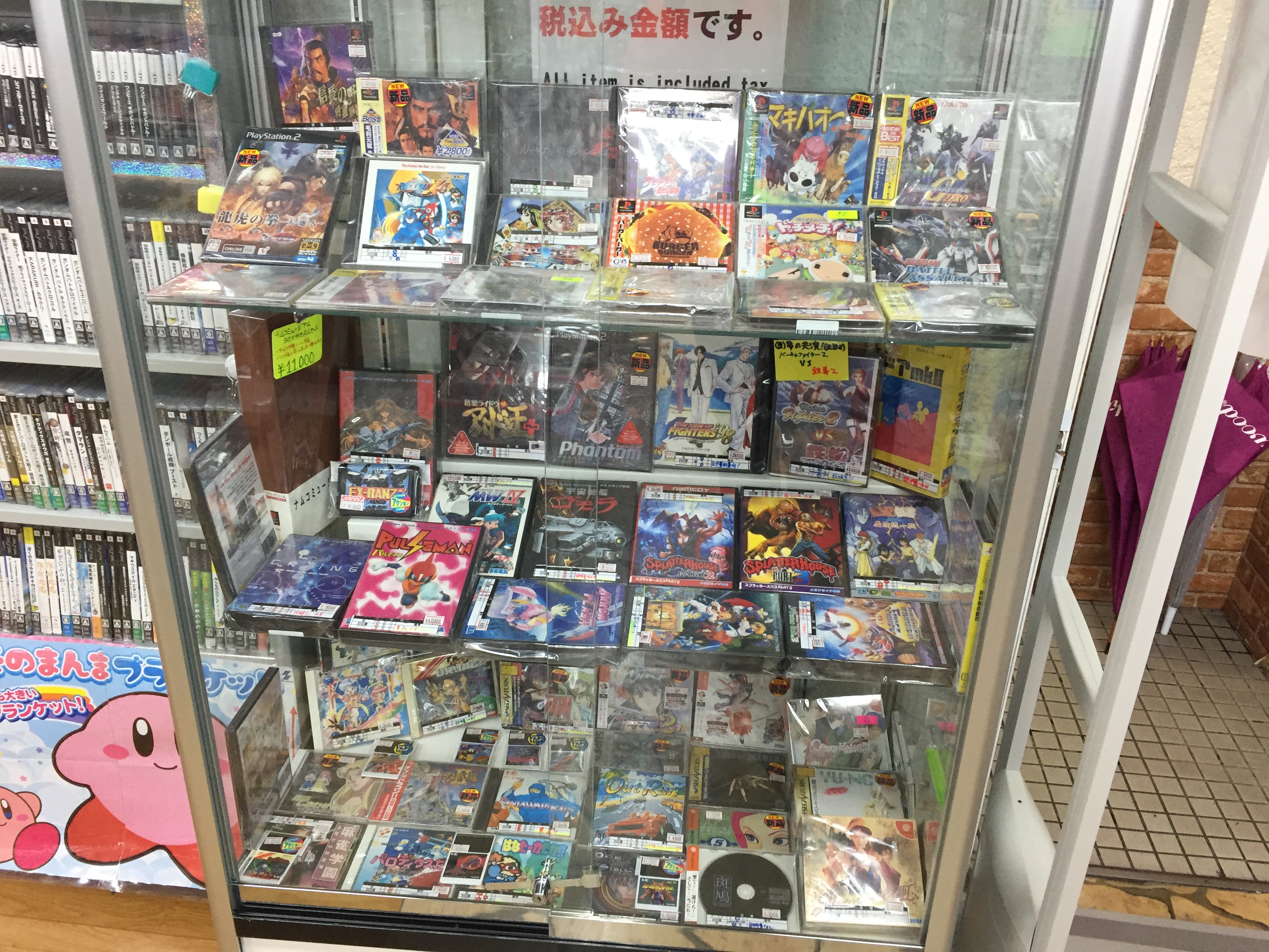 Display case of retro video game covers and discs in Akihabara